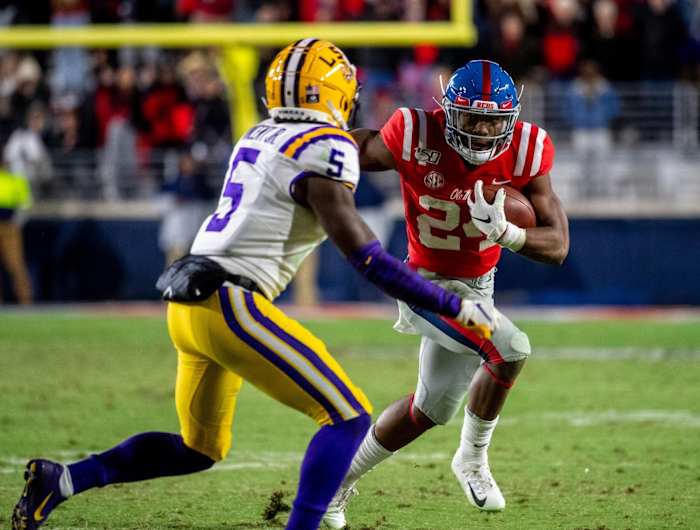 Mississippi Rebels running back Snoop Conner (24) runs at Louisiana State Tigers defensive back Kary Vincent, Jr. (5) at Vaught-Hemingway Stadium. Mandatory Credit: Vasha Hunt-USA TODAY Sports
